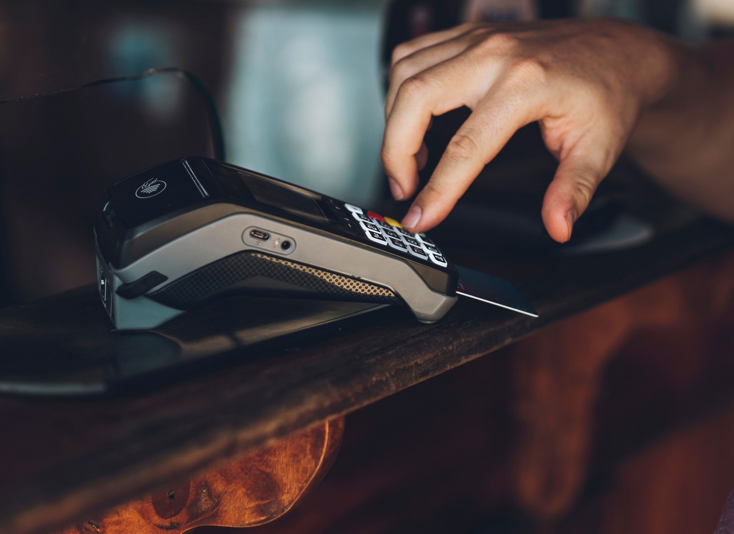 Handheld Wireless PIN Debit Terminal in Hand